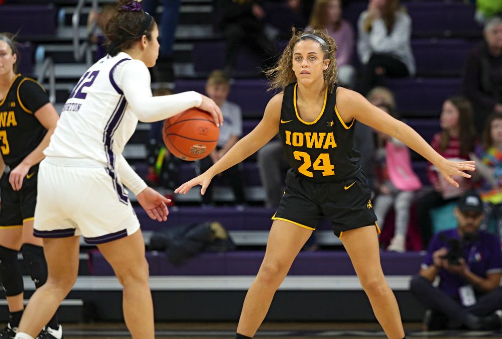 Iowa Hawkeyes guard Gabbie Marshall (24) defends during the third quarter of their game at Welsh-Ryan Arena in Evanston, Ill. on Sunday, January 5, 2020. (Stephen Mally/hawkeyesports.com)