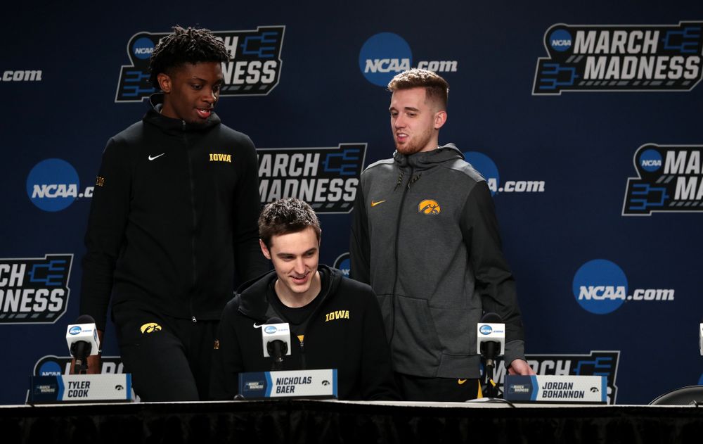 Iowa Hawkeyes forward Tyler Cook (25), forward Nicholas Baer (51), and guard Jordan Bohannon (3) during press availability and practice before the first round of the 2019 NCAA Men's Basketball Tournament Thursday, March 21, 2019 at Nationwide Arena in Columbus, Ohio. (Brian Ray/hawkeyesports.com)