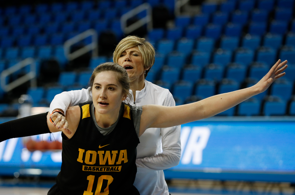 Iowa Hawkeyes forward Megan Gustafson (10) works against associate head coach Jan Jensen during practice Friday, March 16, 2018 at Pauley Pavilion on the campus of UCLA. (Brian Ray/hawkeyesports.com)