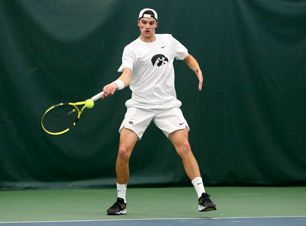 Iowa’s Joe Tyler returns a shot during his singles match at the Hawkeye Tennis and Recreation Complex in Iowa City on Sunday, February 16, 2020. (Stephen Mally/hawkeyesports.com)