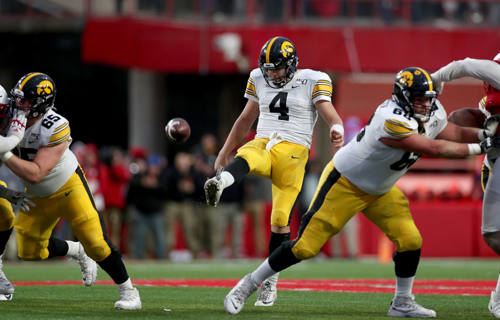 Iowa Hawkeyes quarterback Nate Stanley (4) punts the ball against the Nebraska Cornhuskers Friday, November 29, 2019 at Memorial Stadium in Lincoln, Neb. (Brian Ray/hawkeyesports.com)