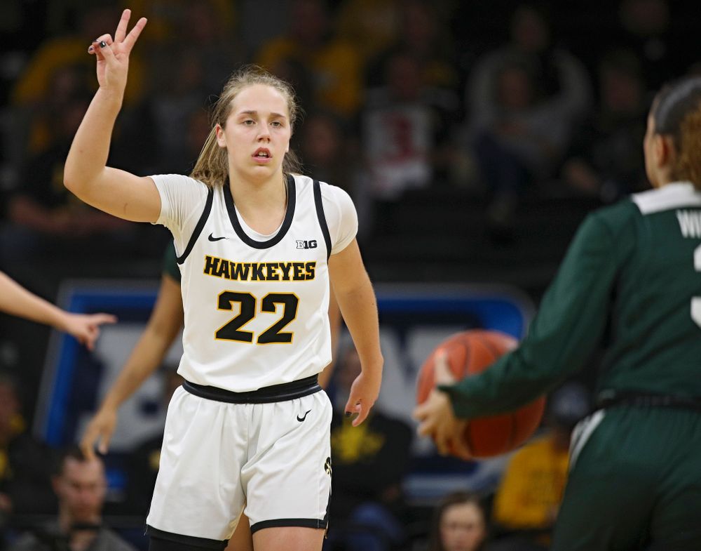 Iowa Hawkeyes guard Kathleen Doyle (22) holds up two fingers as she calls a play during the first quarter of their game at Carver-Hawkeye Arena in Iowa City on Sunday, January 26, 2020. (Stephen Mally/hawkeyesports.com)