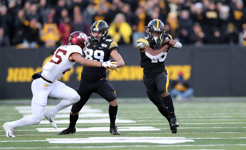 Iowa Hawkeyes running back Tyler Goodson (15) picks up a first down against the Minnesota Golden Gophers Saturday, November 16, 2019 at Kinnick Stadium. (Brian Ray/hawkeyesports.com)