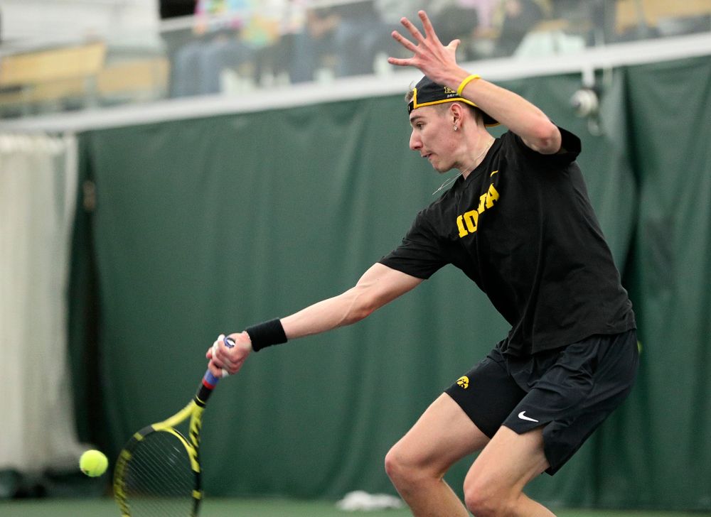Iowa’s Nikita Snezhko returns a shot during his singles match at the Hawkeye Tennis and Recreation Complex in Iowa City on Friday, February 14, 2020. (Stephen Mally/hawkeyesports.com)