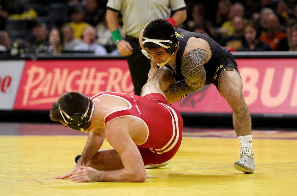 IowaÕs Pat Lugo wrestles WisconsinÕs Cole Martin at 149 pounds Sunday, December 1, 2019 at Carver-Hawkeye Arena. Lugo won the match 5-3. (Brian Ray/hawkeyesports.com)