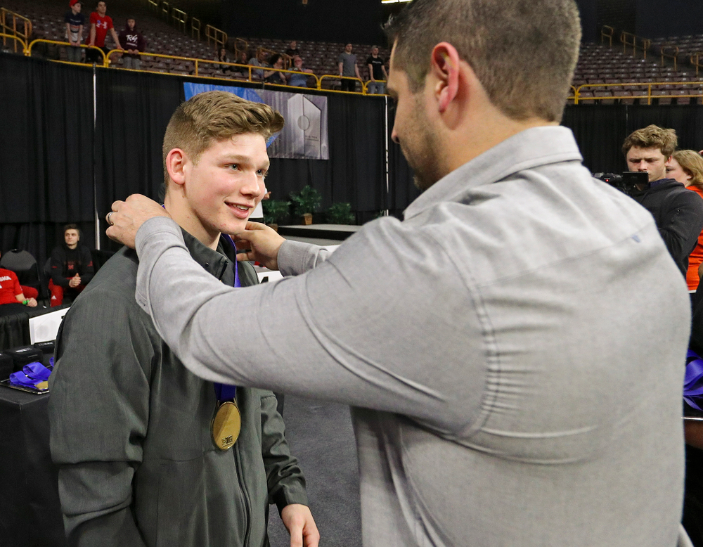 Iowa's Stewart Brown receives a bronze medal for this
third place finish in the vault during the second day of the Big Ten Men's Gymnastics Championships at Carver-Hawkeye Arena in Iowa City on Saturday, Apr. 6, 2019. (Stephen Mally/hawkeyesports.com)