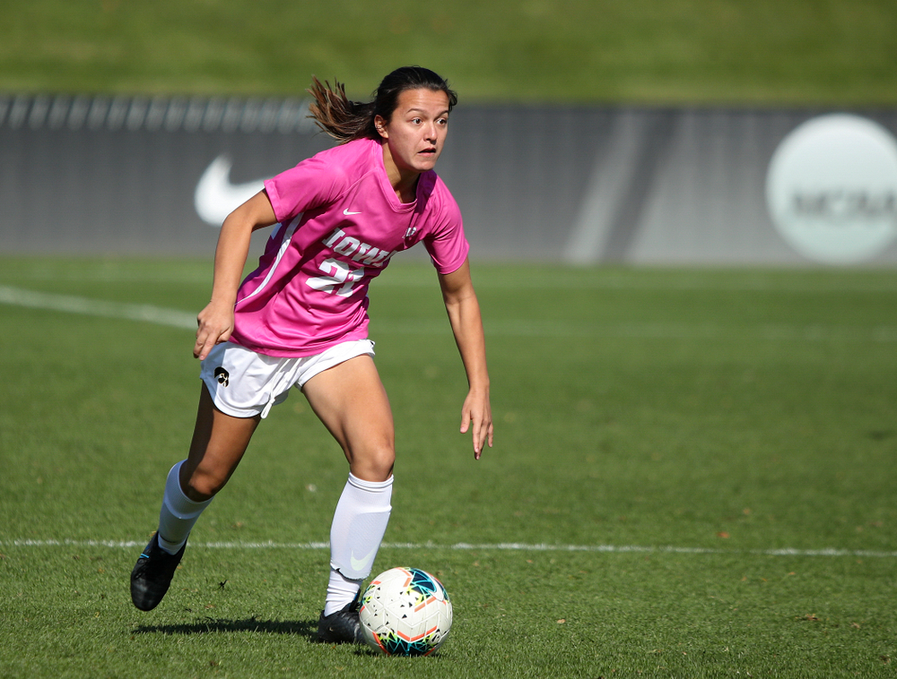 Iowa forward Emma Tokuyama (21) looks down field as she moves with the ball during the first half of their match at the Iowa Soccer Complex in Iowa City on Sunday, Oct 27, 2019. (Stephen Mally/hawkeyesports.com)