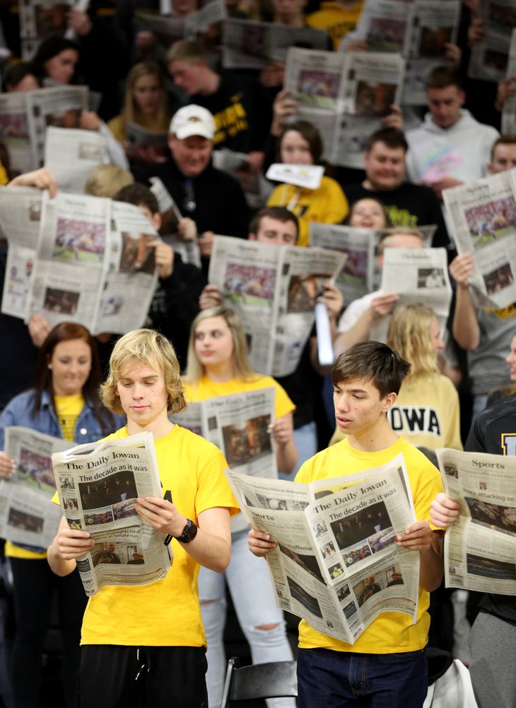 The Hawksnest reads copies of the Daily Iowan during introductions before the Iowa Hawkeyes game against the Michigan Wolverines Friday, January 17, 2020 at Carver-Hawkeye Arena. (Brian Ray/hawkeyesports.com)