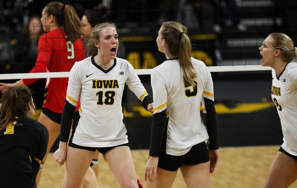 Iowa Hawkeyes middle blocker Hannah Clayton (18) celebrates after winning a point during a match against Maryland at Carver-Hawkeye Arena on November 23, 2018. (Tork Mason/hawkeyesports.com)
