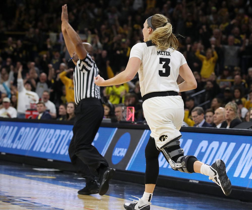 Iowa Hawkeyes guard Makenzie Meyer (3) plays the "air guitar" as she celebrates after making a 3-pointer during the fourth quarter of their second round game in the 2019 NCAA Women's Basketball Tournament at Carver Hawkeye Arena in Iowa City on Sunday, Mar. 24, 2019. (Stephen Mally for hawkeyesports.com)