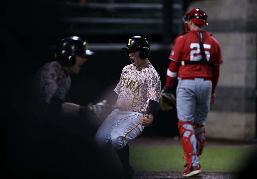 Iowa Hawkeyes outfielder Justin Jenkins (6) scores the game winning run in the bottom of the 9th against the Nebraska Cornhuskers on Military Appreciation Night Friday, April 19, 2019 at Duane Banks Field. (Brian Ray/hawkeyesports.com)