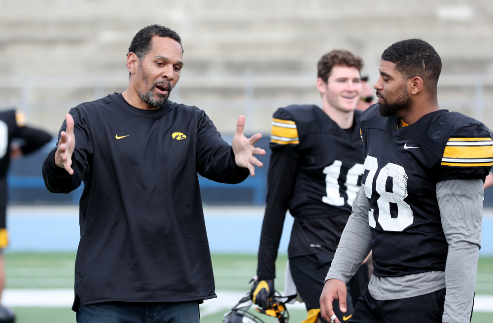 Former Hawkeye Football player Quinn Early talks with running back Toren Young (28) following Holiday Bowl Practice No. 3 Tuesday, December 24, 2019 at San Diego Mesa College. (Brian Ray/hawkeyesports.com)