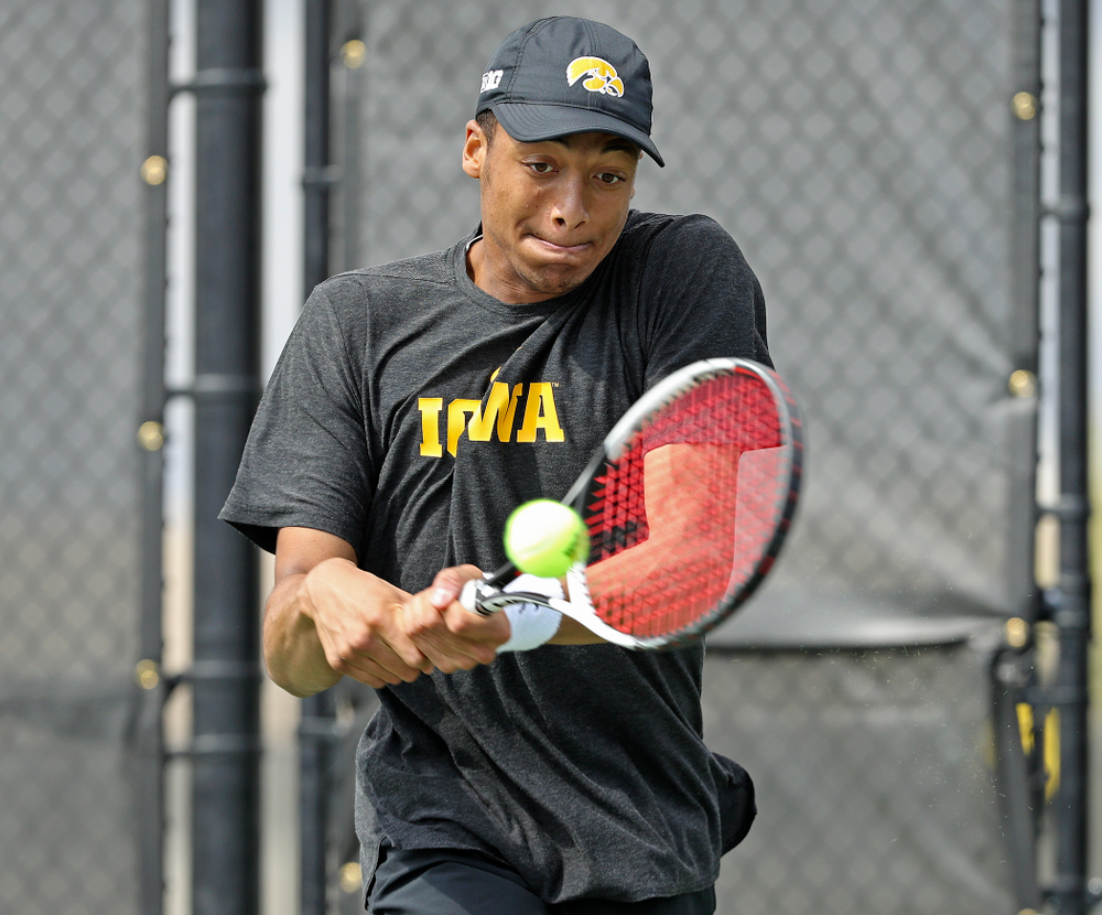 Iowa's Oliver Okonkwo competes during a match against Ohio State at the Hawkeye Tennis and Recreation Complex in Iowa City on Sunday, Apr. 7, 2019. (Stephen Mally/hawkeyesports.com)