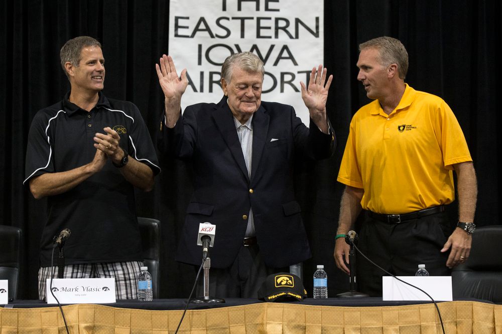 Former Hawkeye Football Head Coach Hayden Fry waves to the crowd at the start of a panel discussion with former quarterback Chuck Long during a panel discussion at Fry Fest Friday, Aug. 29, 2014 in Coralville. (Brian Ray/hawkeyesports.com)