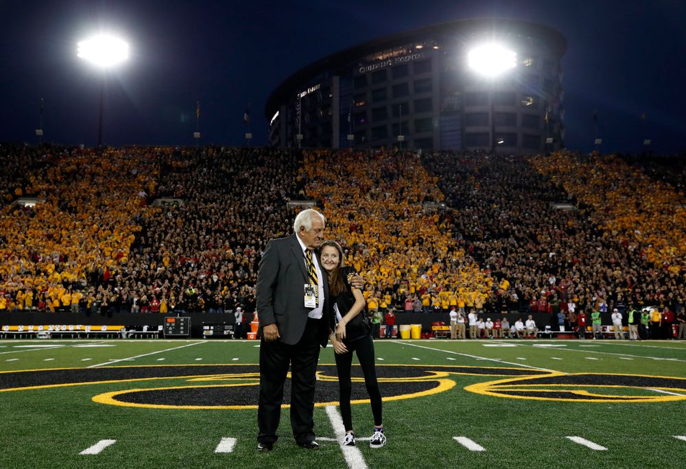 Honorary Captain Tom Moore and Kid Captain Kiersten Mann before the Iowa Hawkeyes game against the Wisconsin Badgers Saturday, September 22, 2018 at Kinnick Stadium. (Brian Ray/hawkeyesports.com)