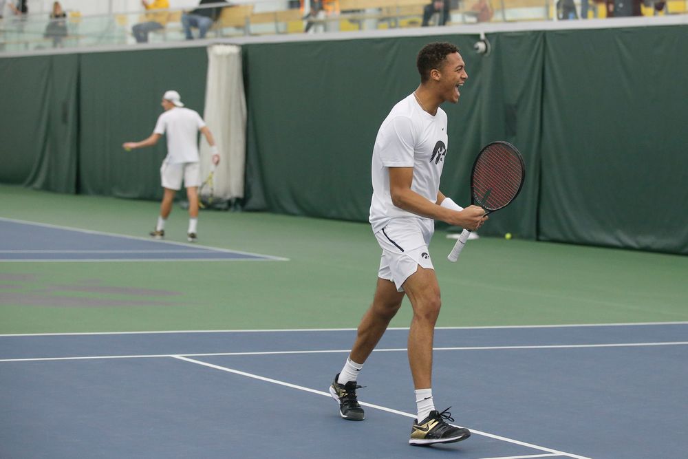 Iowa’s Oliver Okonkwo celebrates a point during the Iowa men’s tennis meet vs Nebraska on Sunday, March 1, 2020 at the Hawkeye Tennis and Recreation Complex. (Lily Smith/hawkeyesports.com)