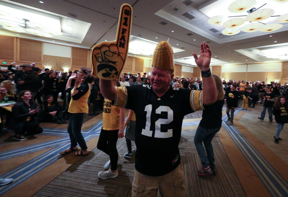 Fans dance to the Hokey Pokey in honor of the late Hayden Fry during the Holiday Bowl Hawkeye Huddle Thursday, December 26, 2019 at the Hilton in downtown San Diego. (Brian Ray/hawkeyesports.com)