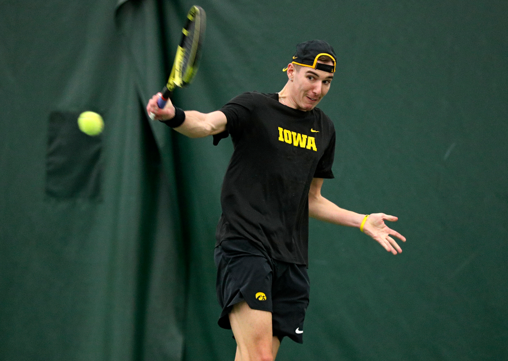 Iowa’s Nikita Snezhko returns a shot during his singles match at the Hawkeye Tennis and Recreation Complex in Iowa City on Friday, February 14, 2020. (Stephen Mally/hawkeyesports.com)