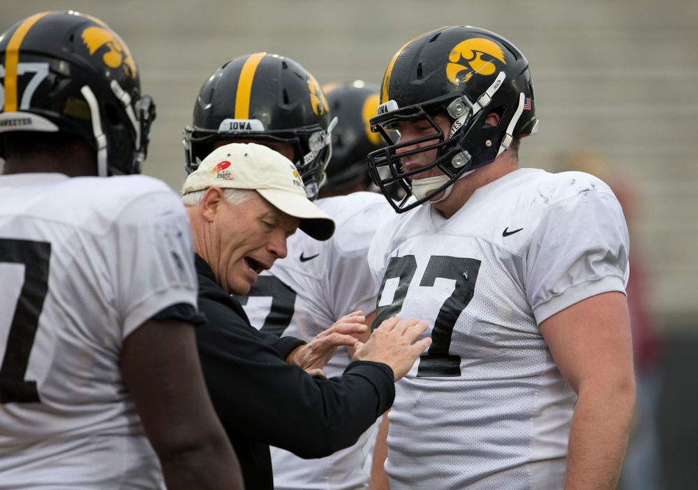 Iowa Hawkeyes defensive line coach Reese Morgan works with defensive lineman Wil Rathjen (87) during spring practice Wednesday, April 16, 2014 at the Kinnick Stadium in Iowa City. (Brian Ray/hawkeyesports.com)