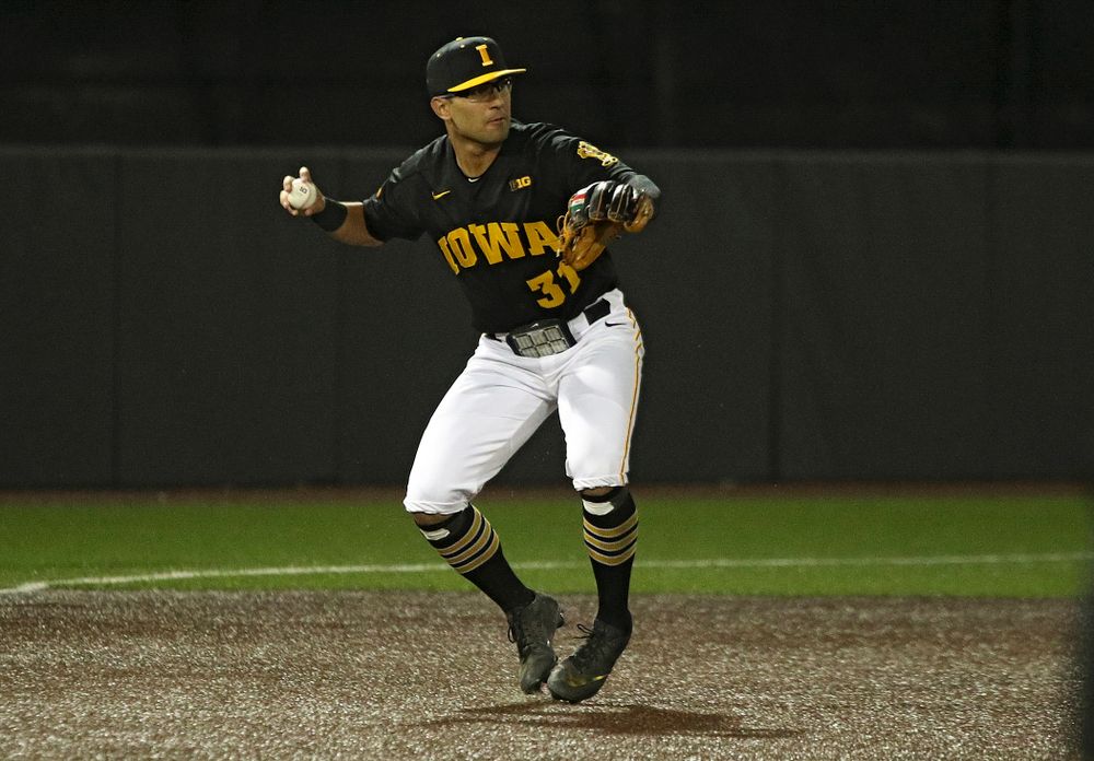 Iowa infielder Matthew Sosa (31) throws to second base to start a double play during the eighth inning of their game at Duane Banks Field in Iowa City on Tuesday, March 3, 2020. (Stephen Mally/hawkeyesports.com)