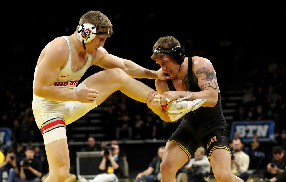 Iowa’s Cash Wilcke wrestles Ohio State’s Kollin Moore at 197 pounds Friday, January 24, 2020 at Carver-Hawkeye Arena. Moore won the match 8-3. (Brian Ray/hawkeyesports.com)