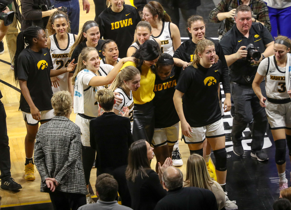 Megan Gustafson walks off the court with the Iowa Hawkeyes after her jersey retirement ceremony at Carver-Hawkeye Arena in Iowa City on Sunday, January 26, 2020. (Stephen Mally/hawkeyesports.com)