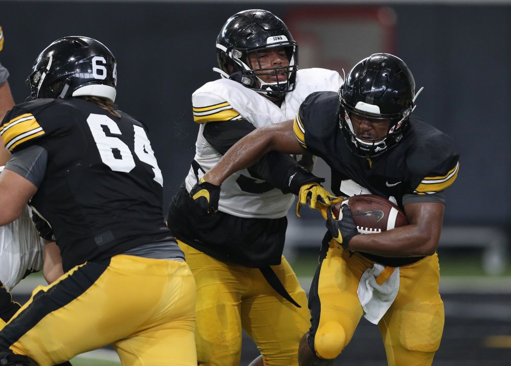 Iowa Hawkeyes defensive lineman Noah Shannon (99) and running back Ivory Kelly-Martin (21) During Fall Camp Practice No. 6 Thursday, August 8, 2019 at the Ronald D. and Margaret L. Kenyon Football Practice Facility. (Brian Ray/hawkeyesports.com)
