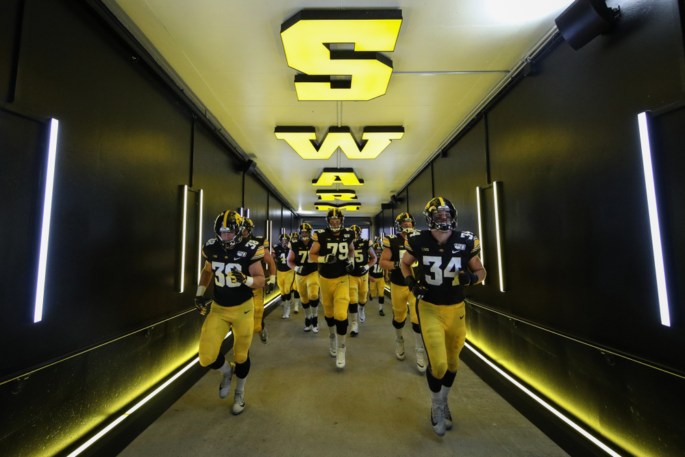 The Iowa Hawkeyes return to the locker room following their game against the Miami RedHawks Saturday, August 31, 2019 at Kinnick Stadium in Iowa City. (Brian Ray/hawkeyesports.com)