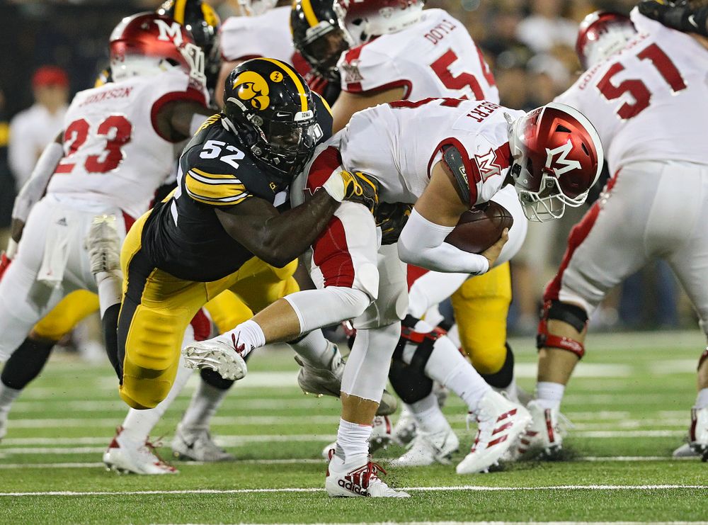Iowa Hawkeyes linebacker Amani Jones (52) sacks Miami (Oh) Redhawks quarterback Brett Gabbert (5) during the third quarter of their game at Kinnick Stadium in Iowa City on Saturday, Aug 31, 2019. (Stephen Mally/hawkeyesports.com)