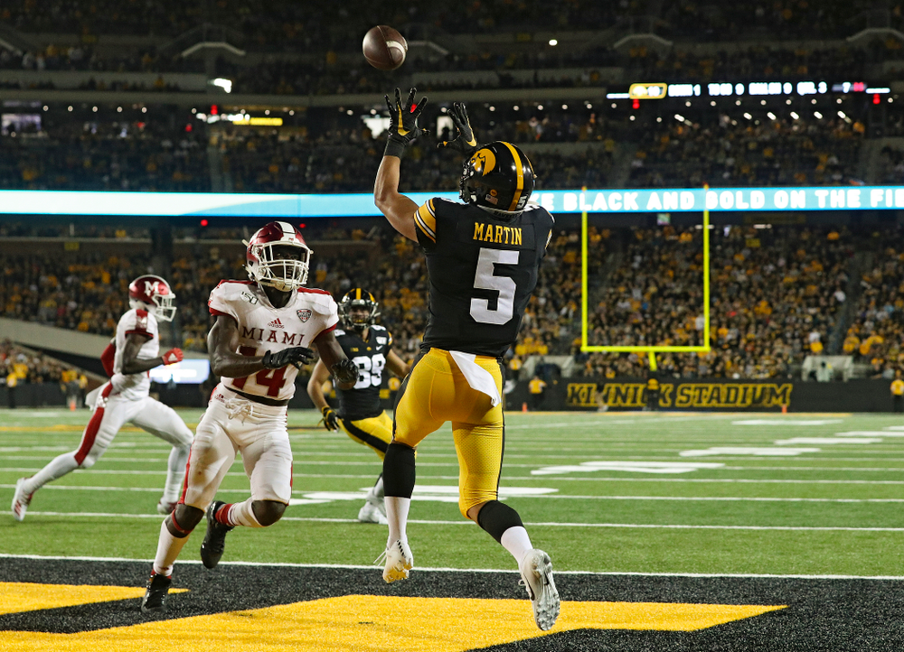 Iowa Hawkeyes wide receiver Oliver Martin (5) pulls in a 9-yard touchdown reception during the third quarter of their game at Kinnick Stadium in Iowa City on Saturday, Aug 31, 2019. (Stephen Mally/hawkeyesports.com)
