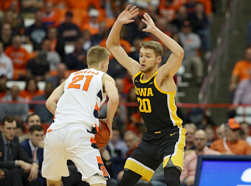Iowa Hawkeyes forward Riley Till (20) eyes Syracuse Orange forward Marek Dolezaj (21) during the first half of their ACC/Big Ten Challenge game at the Carrier Dome in Syracuse, N.Y. on Tuesday, Dec 3, 2019. (Stephen Mally/hawkeyesports.com)