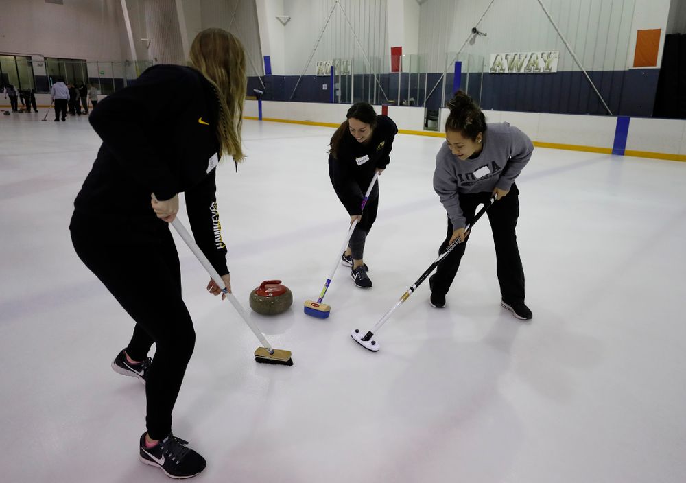 Members of the Iowa Softball team learn the sport of curling as part of a team building event Wednesday, January 10, 2018 at the Cedar Rapids Ice Arena. (Brian Ray/hawkeyesports.com)