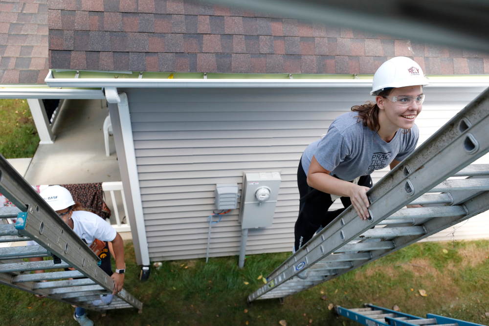 Iowa Hawkeyes guard Tania Davis (11) and forward/center Paula Valino Ramos (31) work on the Habitat for Humanity Women's Build Wednesday, September 26, 2018 in Iowa City. (Brian Ray/hawkeyesports.com)