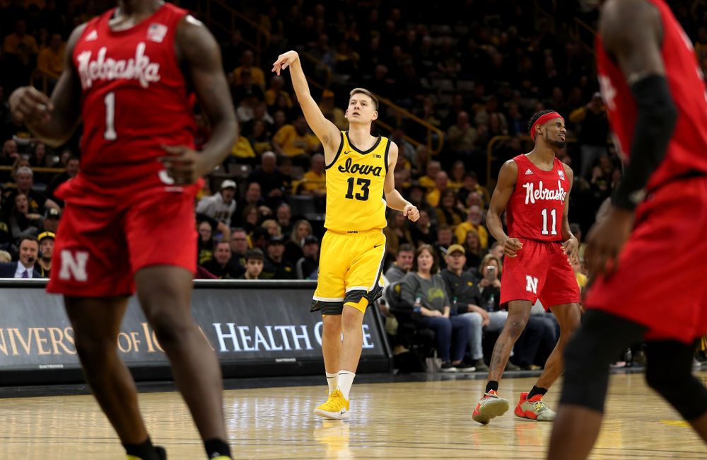 Iowa Hawkeyes guard Austin Ash (13) knocks down a three point basket against the Nebraska Cornhuskers Saturday, February 8, 2020 at Carver-Hawkeye Arena. (Brian Ray/hawkeyesports.com)