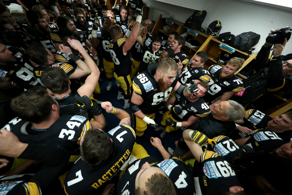 The Iowa Hawkeyes do the Hokey Pokey in the locker room to honor the late Hayden Fry following their win against USC in the Holiday Bowl Saturday, December 28, 2019 at San Diego Community Credit Union Stadium. (Brian Ray/hawkeyesports.com)