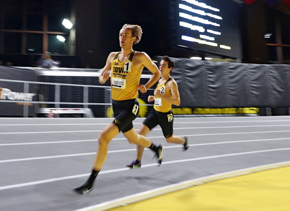 Iowa’s Jeff Roberts (from left) and Noah Healy run the men’s 1 mile run event during the Jimmy Grant Invitational at the Recreation Building in Iowa City on Saturday, December 14, 2019. (Stephen Mally/hawkeyesports.com)