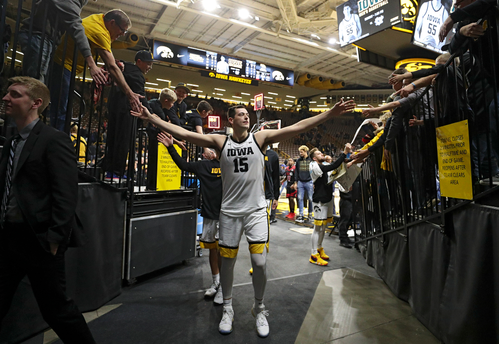 Iowa Hawkeyes forward Ryan Kriener (15) greets fans after winning their game at Carver-Hawkeye Arena in Iowa City on Friday, Nov 8, 2019. (Stephen Mally/hawkeyesports.com)