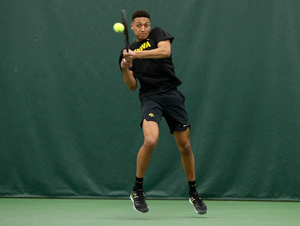 Iowa’s Oliver Okonkwo returns a shot during his doubles match at the Hawkeye Tennis and Recreation Complex in Iowa City on Friday, February 14, 2020. (Stephen Mally/hawkeyesports.com)