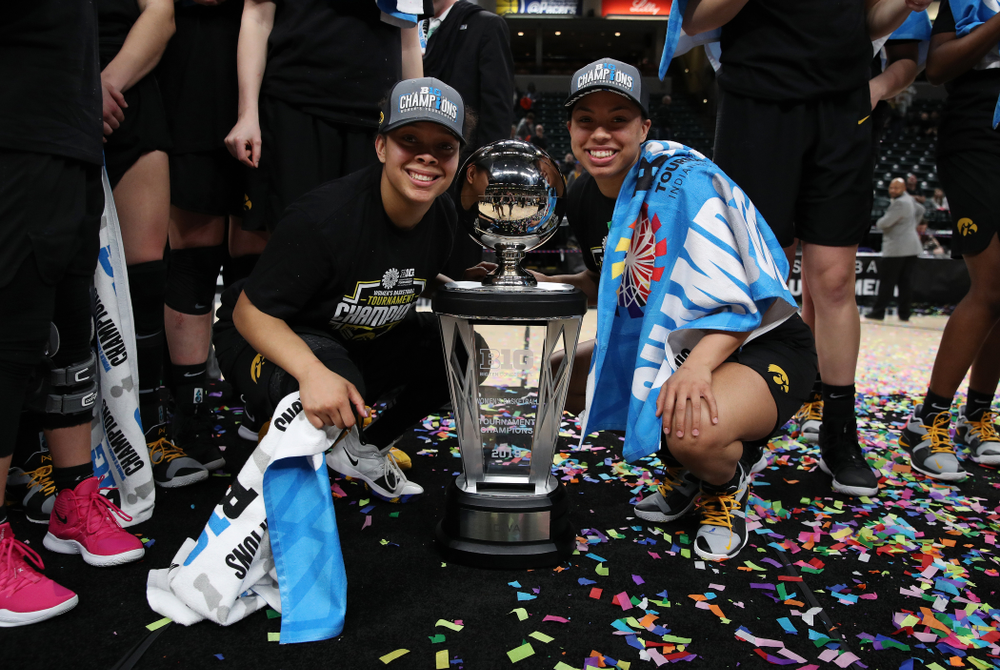 Iowa Hawkeyes guard Tania Davis (11) and guard Zion Sanders (24) celebrate their victory over the Maryland Terrapins in the Big Ten Championship Game Sunday, March 10, 2019 at Bankers Life Fieldhouse in Indianapolis, Ind. (Brian Ray/hawkeyesports.com)