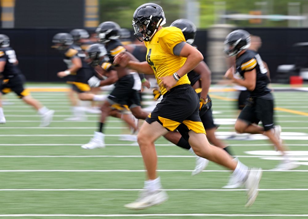 Iowa Hawkeyes quarterback Nate Stanley (4) runs with his teammates as he warms up during Fall Camp Practice No. 15 at the Hansen Football Performance Center in Iowa City on Monday, Aug 19, 2019. (Stephen Mally/hawkeyesports.com)