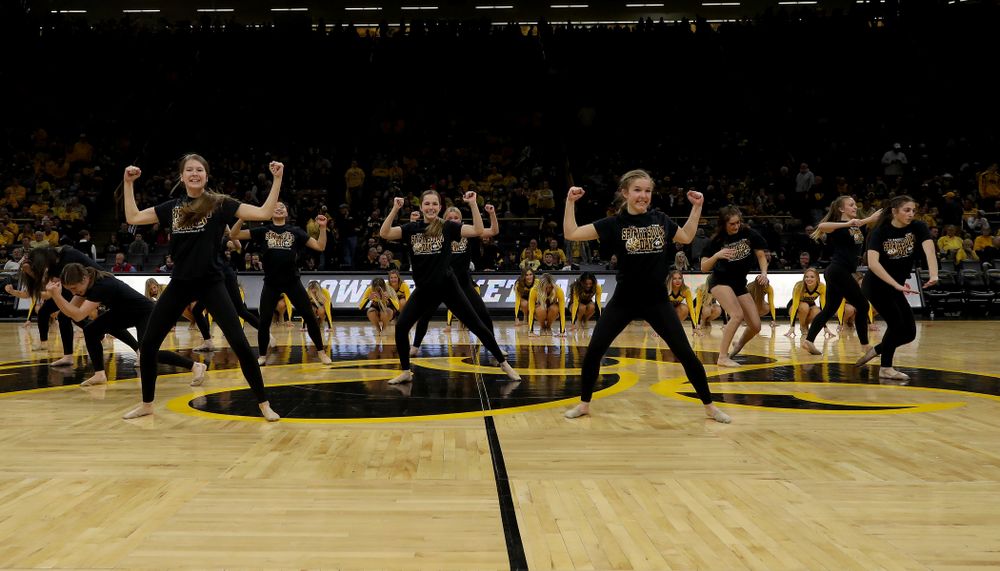 The Iowa Spirit Squad performs with participants in Spirit Squad Day at halftime of the Iowa Hawkeyes game against the Nebraska Cornhuskers Saturday, February 8, 2020 at Carver-Hawkeye Arena. (Brian Ray/hawkeyesports.com)