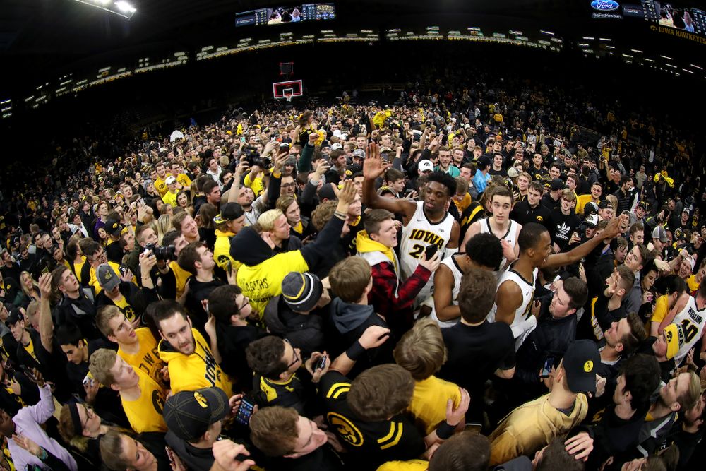 Iowa Hawkeyes guard Maishe Dailey (1) and forward Tyler Cook (25) celebrate with fans after defeating the Michigan Wolverines Friday, February 1, 2019 at Carver-Hawkeye Arena. (Brian Ray/hawkeyesports.com)