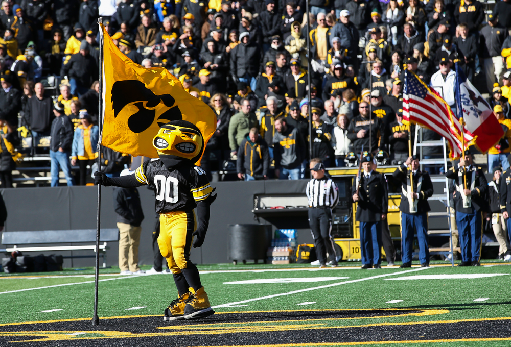Herky the Hawk plants a flag at midfield before a game against Maryland at Kinnick Stadium on October 20, 2018. (Tork Mason/hawkeyesports.com)