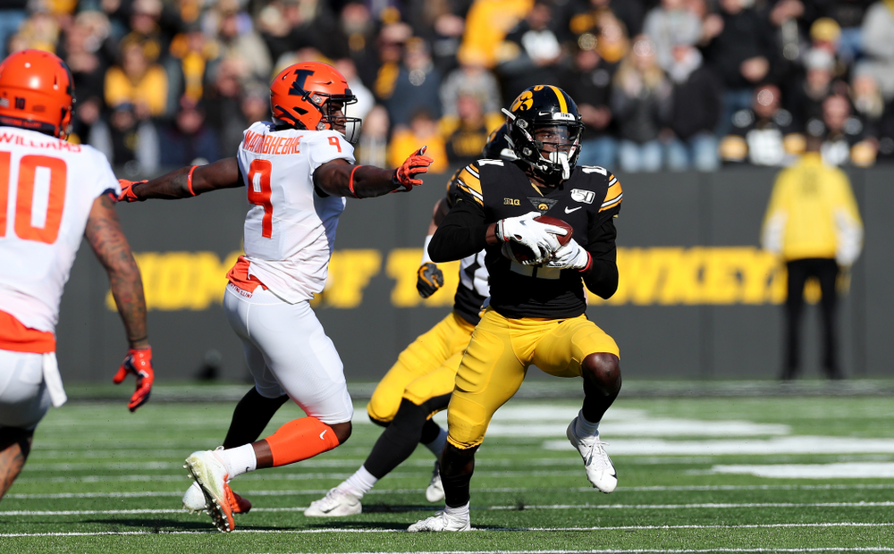 Iowa Hawkeyes defensive back Michael Ojemudia (11) intercepts a pass against the Illinois Fighting Illini Saturday, November 23, 2019 at Kinnick Stadium. (Brian Ray/hawkeyesports.com)