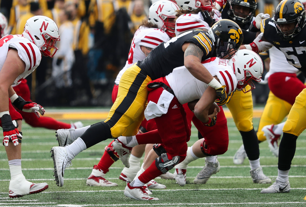 Iowa Hawkeyes defensive end A.J. Epenesa (94) sacks the quarterback during a game against Nebraska at Kinnick Stadium on November 23, 2018. (Tork Mason/hawkeyesports.com)