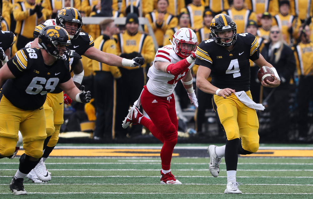 Iowa Hawkeyes quarterback Nate Stanley (4) runs the ball during a game against Nebraska at Kinnick Stadium on November 23, 2018. (Tork Mason/hawkeyesports.com)