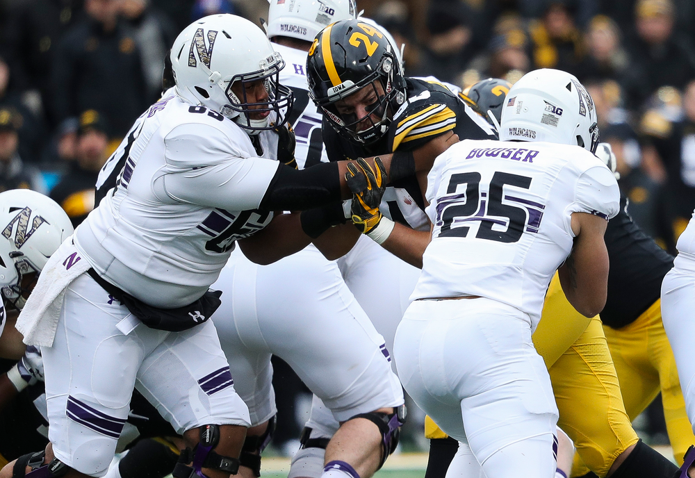 Iowa Hawkeyes defensive end Sam Brincks (90) fights off a block during a game against Northwestern at Kinnick Stadium on November 10, 2018. (Tork Mason/hawkeyesports.com)