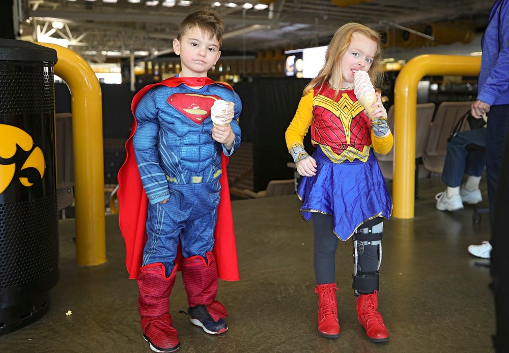 Two young fans eat ice cream cones on Superhero and Princess Day before the meet at Carver-Hawkeye Arena in Iowa City on Sunday, March 8, 2020. (Stephen Mally/hawkeyesports.com)