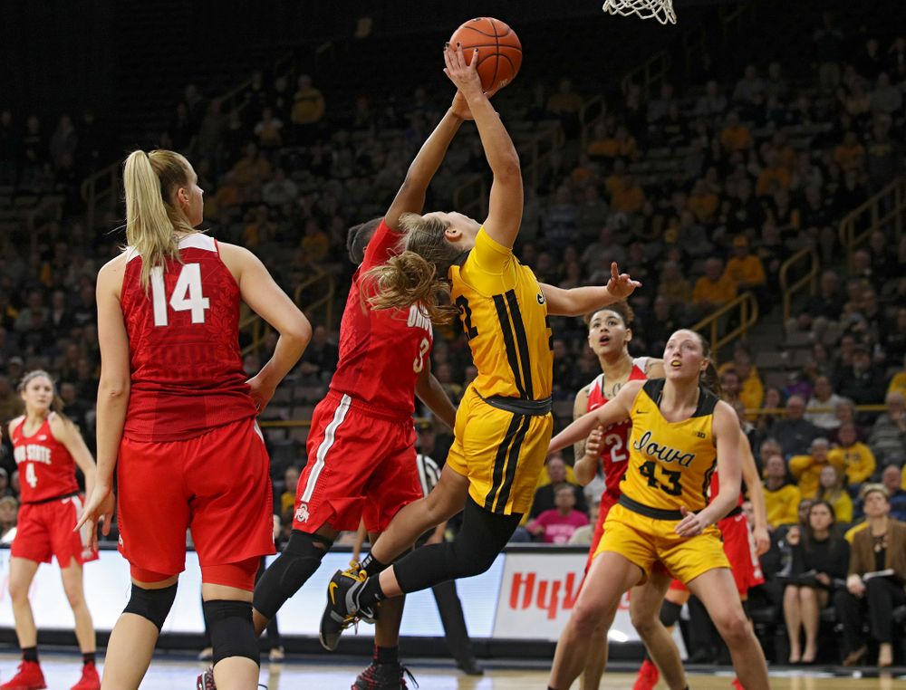 Iowa Hawkeyes guard Kathleen Doyle (22) scores a basket while being fouled during the fourth quarter of their game at Carver-Hawkeye Arena in Iowa City on Thursday, January 23, 2020. (Stephen Mally/hawkeyesports.com)