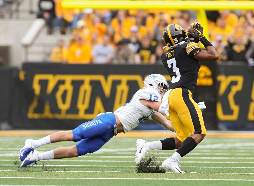 Iowa Hawkeyes wide receiver Tyrone Tracy Jr. (3) pulls in a pass after it bounced off the hands of Middle Tennessee State free safety Reed Blankenship (12) during the first quarter of their game at Kinnick Stadium in Iowa City on Saturday, Sep 28, 2019. (Stephen Mally/hawkeyesports.com)